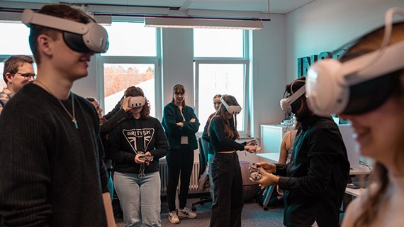 A group of people wearing VR headsets